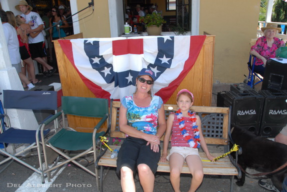 Stacie and Jessica in front of American Flag Independence Day decorations