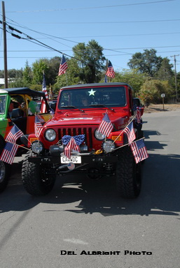 CA4WDC Jeep with flags ready for July 4th parade