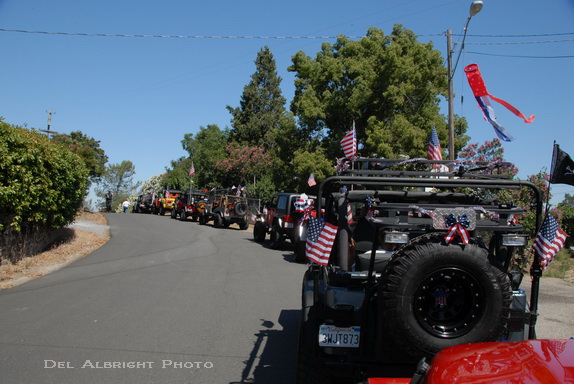 Four-wheel drives lined up for Independence Day parade in Moke Hill, CA