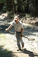 Scott Johnston with shovel full of rock
