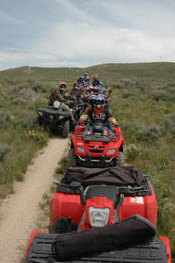 Quads lined up near Harrison Pass